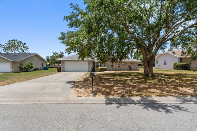 790 Chelsea Way, Lake Wales, FL 33853 - ranch-style house featuring concrete driveway, a front yard, a garage, and brick siding