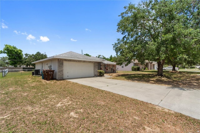 790 Chelsea Way, Lake Wales, FL 33853 - view of front facade featuring driveway, an attached garage, and brick siding