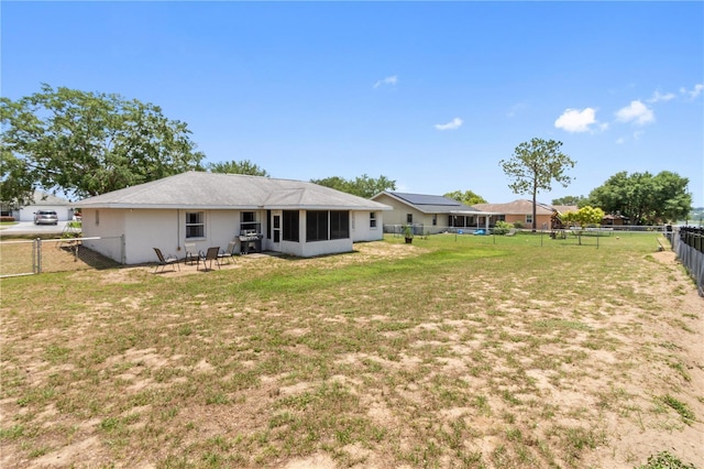 790 Chelsea Way, Lake Wales, FL 33853 - rear view of property with a sunroom