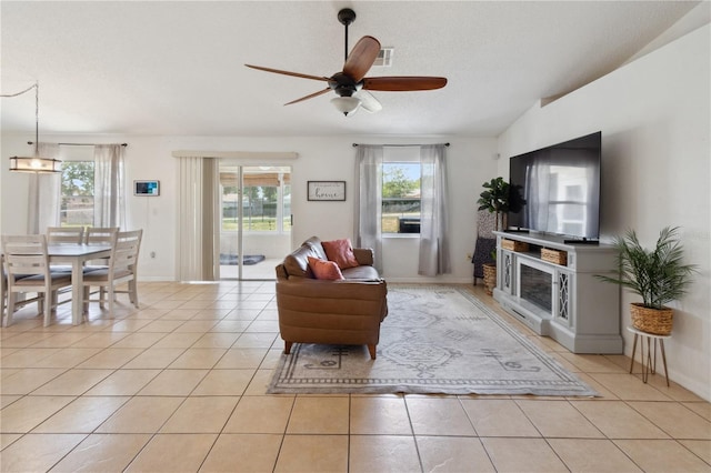 790 Chelsea Way, Lake Wales, FL 33853 - living area with a ceiling fan, light tile patterned floors, and baseboards