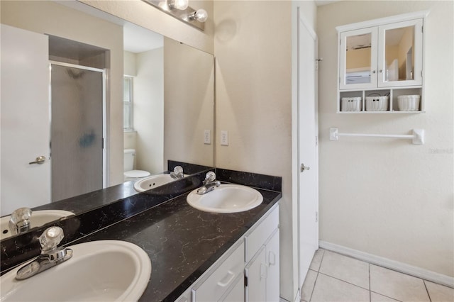 790 Chelsea Way, Lake Wales, FL 33853 - full bath featuring double vanity, a stall shower, tile patterned flooring, toilet, and baseboards
