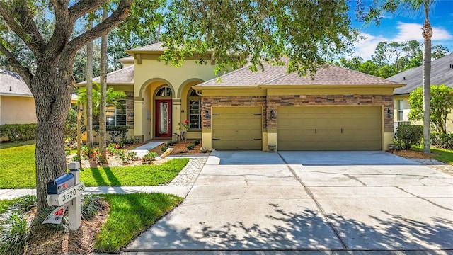 3620 Cordgrass Dr, Valrico, FL 33596 - mediterranean / spanish house featuring a garage, concrete driveway, stucco siding, and a shingled roof