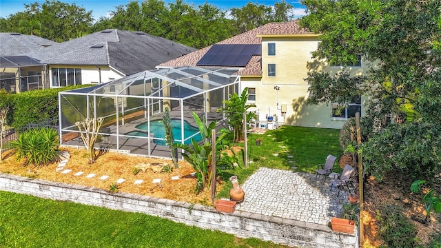 3620 Cordgrass Dr, Valrico, FL 33596 - rear view of property featuring a patio, an outdoor pool, stucco siding, a yard, and a lanai