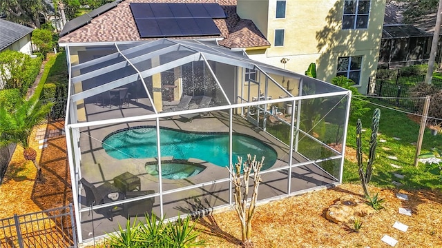 3620 Cordgrass Dr, Valrico, FL 33596 - view of pool with glass enclosure, a patio, a pool with connected hot tub, and fence