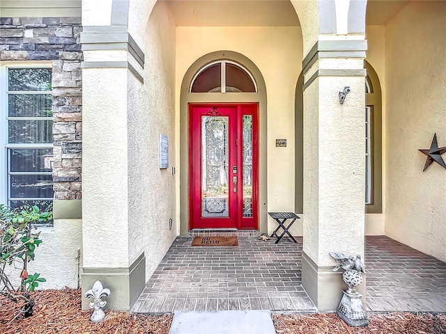 3620 Cordgrass Dr, Valrico, FL 33596 - doorway to property with stucco siding and stone siding