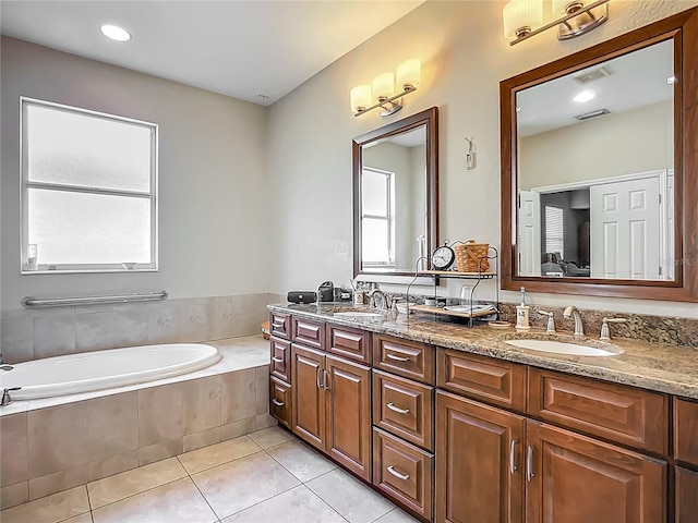 3620 Cordgrass Dr, Valrico, FL 33596 - full bath featuring tile patterned flooring, a garden tub, and double vanity