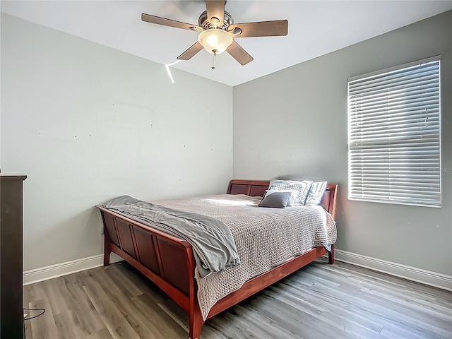 3620 Cordgrass Dr, Valrico, FL 33596 - bedroom featuring wood finished floors, baseboards, and ceiling fan
