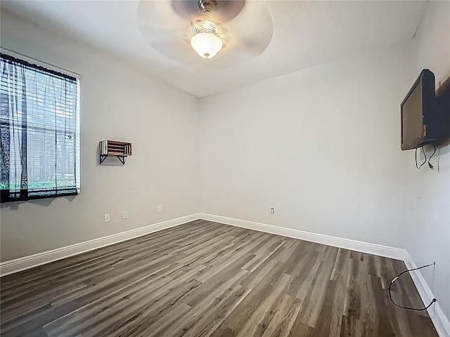 3620 Cordgrass Dr, Valrico, FL 33596 - empty room featuring dark wood-style flooring, baseboards, and a ceiling fan