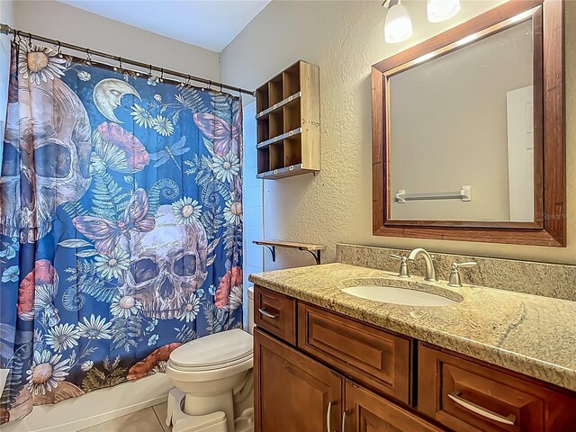 3620 Cordgrass Dr, Valrico, FL 33596 - bathroom with tile patterned floors, toilet, vanity, shower / bath combo with shower curtain, and a textured wall