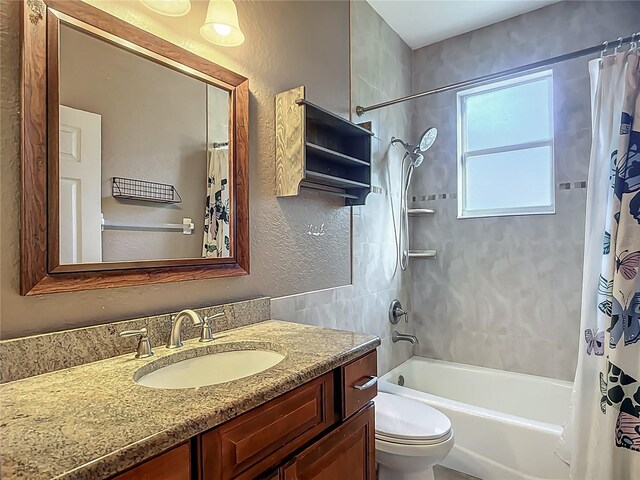 3620 Cordgrass Dr, Valrico, FL 33596 - full bath with shower / tub combo, vanity, a textured wall, and toilet
