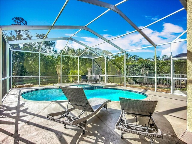 3620 Cordgrass Dr, Valrico, FL 33596 - view of swimming pool featuring a patio, a pool with connected hot tub, and a lanai