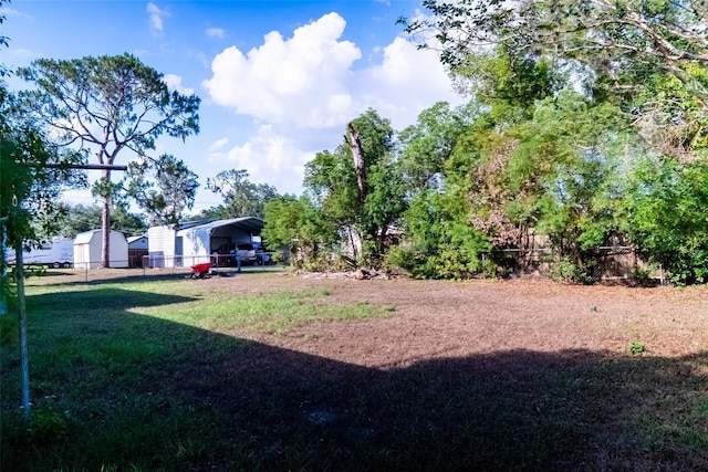 view of yard featuring a detached carport