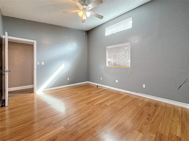 6350 92nd Pl N Unit 2206, Pinellas Park, FL 33782 - empty room featuring a textured wall, ceiling fan, light wood-style flooring, a textured ceiling, and baseboards