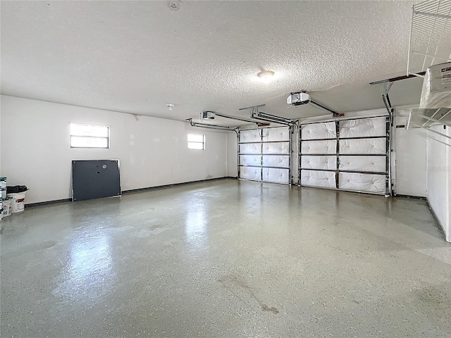 6350 92nd Pl N Unit 2206, Pinellas Park, FL 33782 - garage with a garage door opener and baseboards