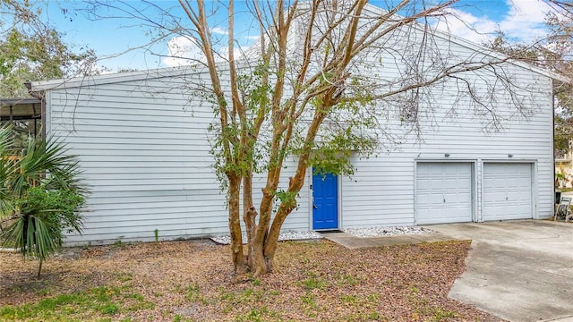 6350 92nd Pl N Unit 2206, Pinellas Park, FL 33782 - view of front of home featuring a garage and driveway