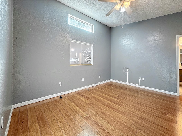6350 92nd Pl N Unit 2206, Pinellas Park, FL 33782 - spare room featuring a textured wall, wood finished floors, a ceiling fan, a textured ceiling, and baseboards