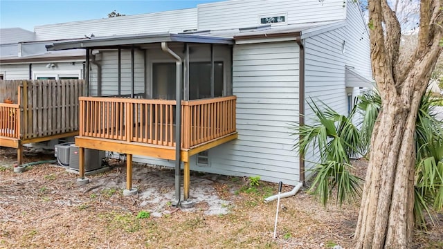 6350 92nd Pl N Unit 2206, Pinellas Park, FL 33782 - rear view of house featuring a deck and central AC