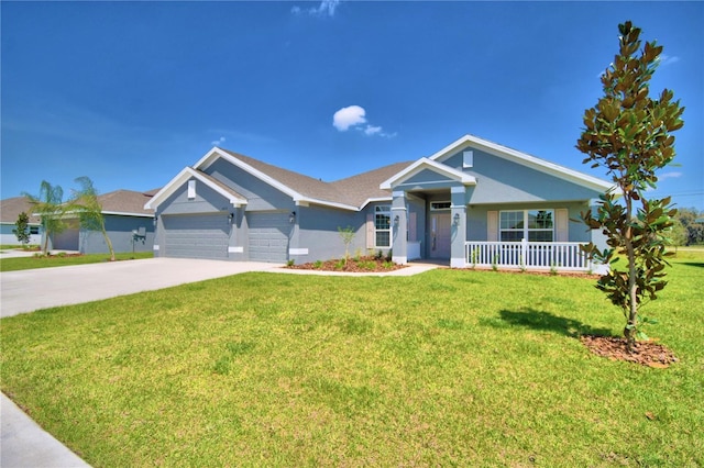 single story home with driveway, an attached garage, covered porch, a front lawn, and stucco siding