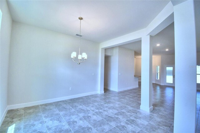 spare room featuring a chandelier, baseboards, recessed lighting, and tile patterned flooring