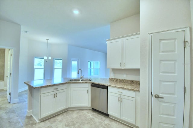 kitchen featuring dishwasher, a sink, a peninsula, white cabinets, and light stone counters