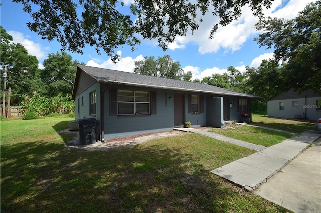 6054-6066 Hilltop Ln W, Lakeland, FL 33809 - ranch-style home with a front yard and a shingled roof