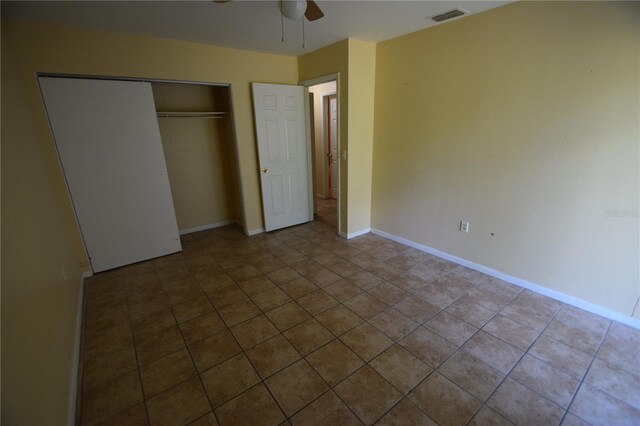 6054-6066 Hilltop Ln W, Lakeland, FL 33809 - unfurnished bedroom featuring tile patterned floors, a closet, baseboards, and ceiling fan