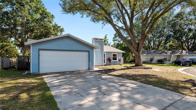 417 Yolonda Ct, Lakeland, FL 33809 - ranch-style house with concrete driveway, fence, and a garage