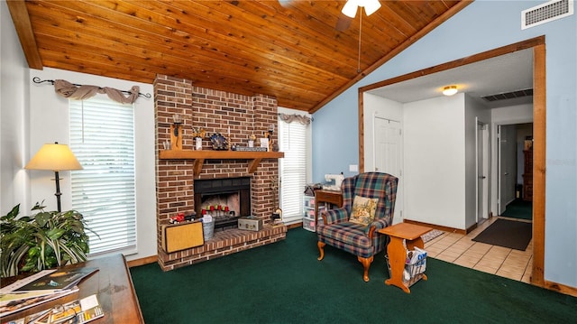 417 Yolonda Ct, Lakeland, FL 33809 - carpeted living room featuring lofted ceiling, a fireplace, ceiling fan, wooden ceiling, and tile patterned flooring