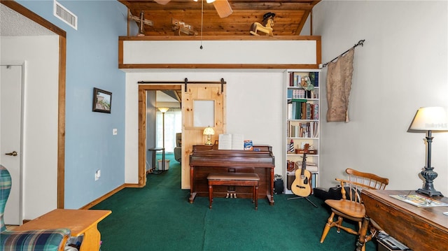 417 Yolonda Ct, Lakeland, FL 33809 - living area featuring carpet flooring, a ceiling fan, wooden ceiling, and a barn door