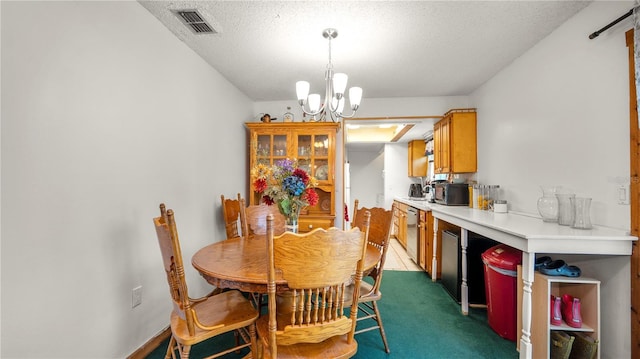 417 Yolonda Ct, Lakeland, FL 33809 - dining area with a chandelier, carpet, and a textured ceiling