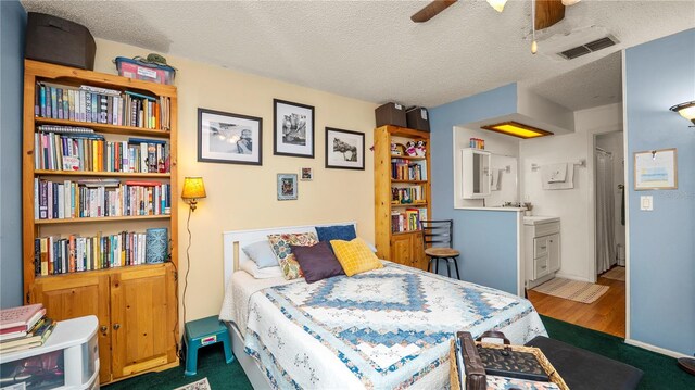 417 Yolonda Ct, Lakeland, FL 33809 - bedroom featuring a textured ceiling and wood finished floors