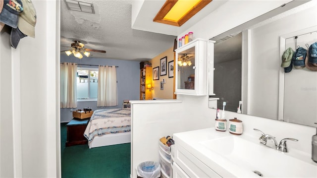 417 Yolonda Ct, Lakeland, FL 33809 - bathroom with a sink, ceiling fan, and a textured ceiling