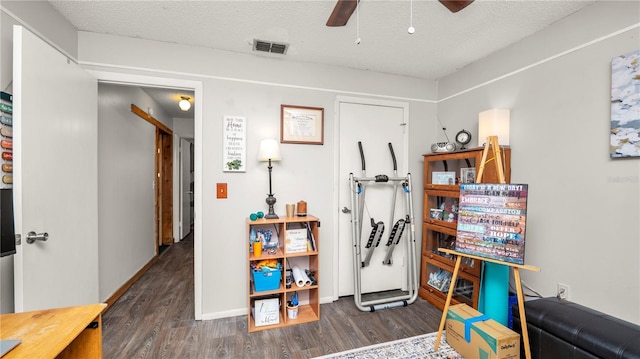 417 Yolonda Ct, Lakeland, FL 33809 - game room with wood finished floors, ceiling fan, a textured ceiling, and baseboards