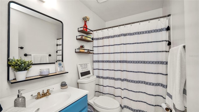 417 Yolonda Ct, Lakeland, FL 33809 - bathroom with toilet, vanity, and a shower with shower curtain
