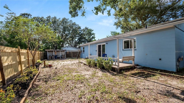 417 Yolonda Ct, Lakeland, FL 33809 - fenced backyard with a deck