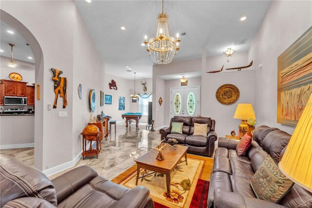 5033 Sugar Bay St, Sebring, FL 33872 - living room featuring arched walkways, billiards, a chandelier, baseboards, and recessed lighting