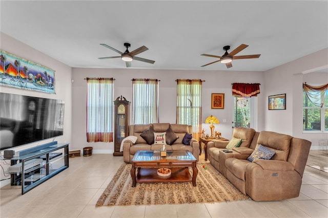 5033 Sugar Bay St, Sebring, FL 33872 - living room with a ceiling fan, light tile patterned floors, and baseboards