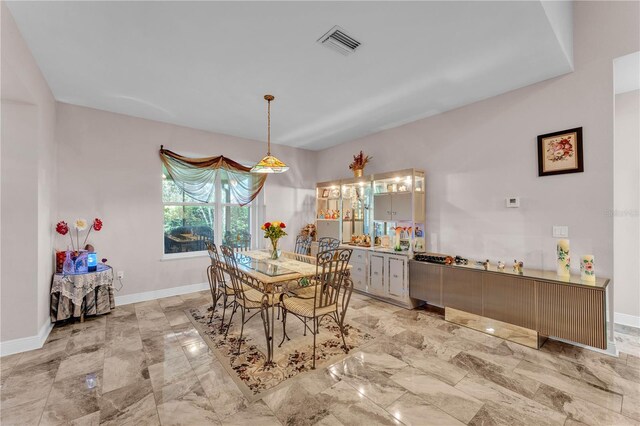 5033 Sugar Bay St, Sebring, FL 33872 - dining area with baseboards and light marble finish flooring