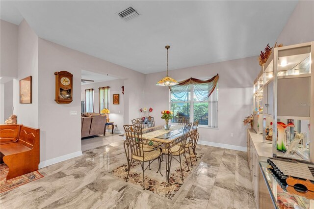 5033 Sugar Bay St, Sebring, FL 33872 - dining space featuring light marble finish floors and baseboards