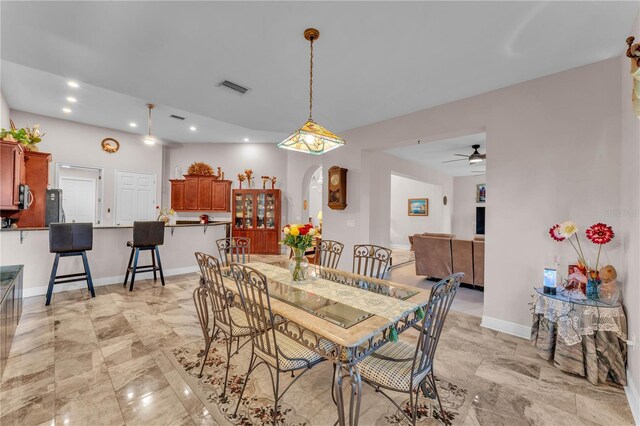 5033 Sugar Bay St, Sebring, FL 33872 - dining area with arched walkways, ceiling fan, recessed lighting, and baseboards