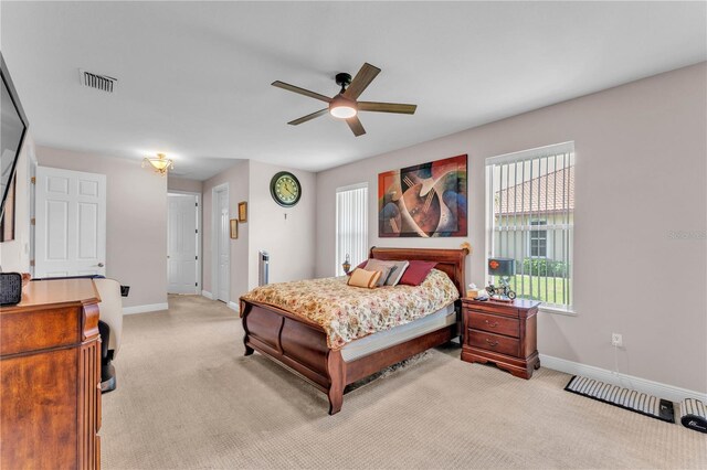 5033 Sugar Bay St, Sebring, FL 33872 - bedroom featuring light colored carpet, baseboards, and ceiling fan