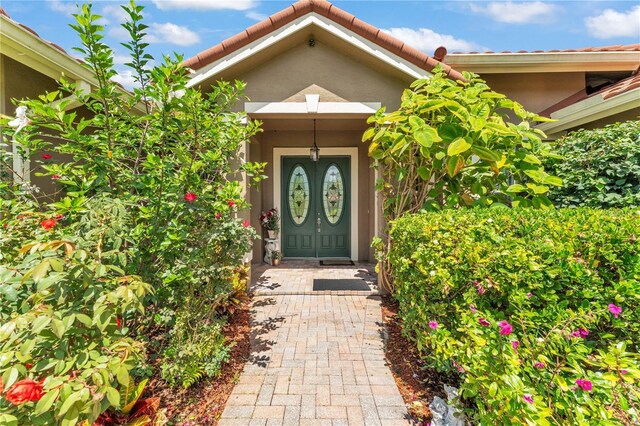 5033 Sugar Bay St, Sebring, FL 33872 - property entrance with stucco siding