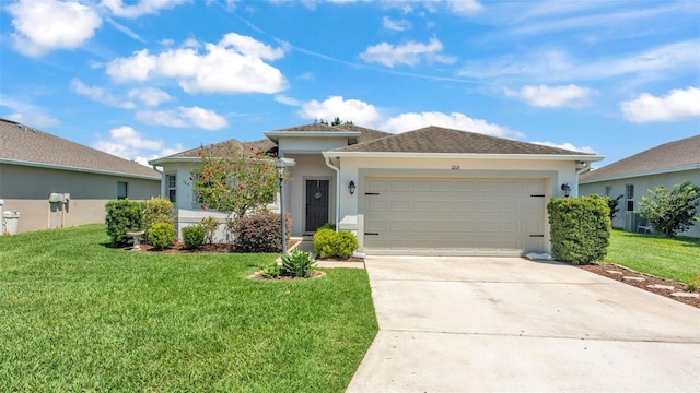 view of front of house with a garage, stucco siding, a front lawn, and driveway