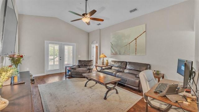 living area with wood finished floors, a ceiling fan, french doors, and high vaulted ceiling