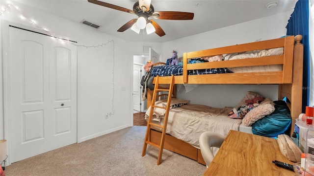 carpeted bedroom with a ceiling fan