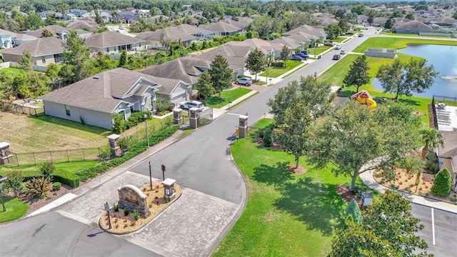 aerial perspective of suburban area with a large body of water
