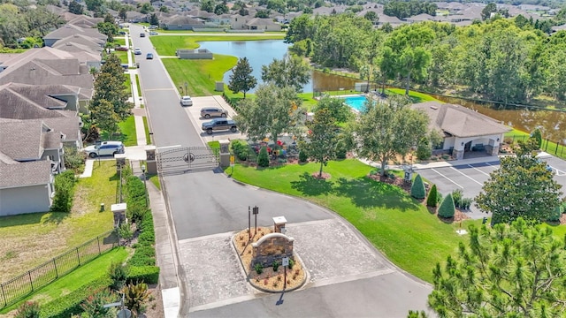 aerial view of residential area featuring a nearby body of water