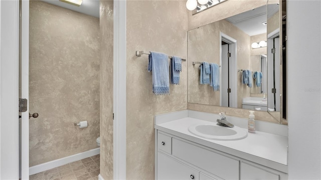 30 Aspen Dr Unit 30, Haines City, FL 33844 - bathroom featuring toilet, vanity, and baseboards