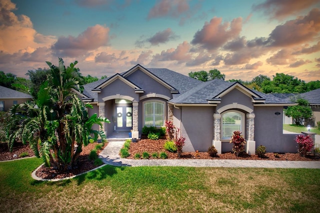 2032 Indian Sky Cir, Lakeland, FL 33813 - single story home with stucco siding, a front lawn, and a shingled roof