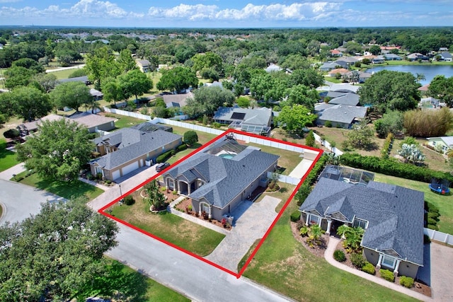 2032 Indian Sky Cir, Lakeland, FL 33813 - aerial perspective of suburban area with property boundaries highlighted and a nearby body of water